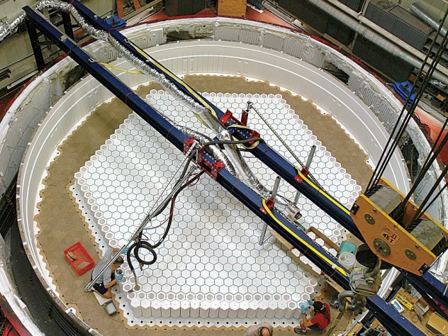 Photograph by Ray Bertram/Courtesy of the University of Arizona Steward Mirror Lab At the Steward Observatory Mirror Lab, in Tucson, staff load the rotary kiln with hexagonal columns of refractory material.