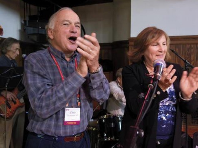 Chris Mortenson and his wife, Winnie, applaud an open-mic music session