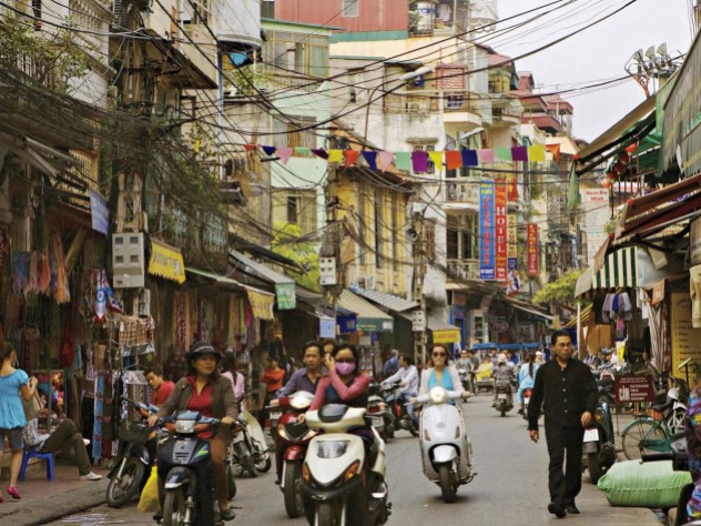Photograph by Chau Doan/Getty Images Hanoi’s streets (in 2007, above) are now full of motorcycles and scooters, and shop shelves are no longer bare.