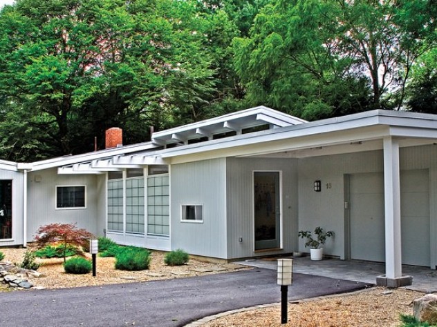 A house in the Five Fields neighborhood nestles against trees.