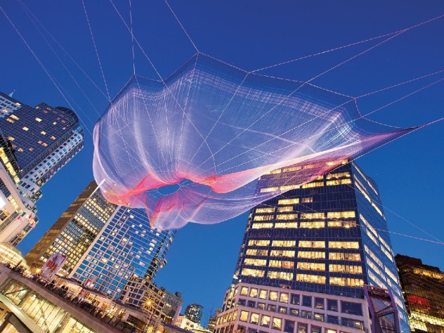 Photograph by Ema Peter/Courtesy of Janet Echelman <i>Skies Painted With</i> <i>Unnumbered Sparks</i> (2014), in Vancouver, allowed viewers to choreograph its lighting using their mobile devices.