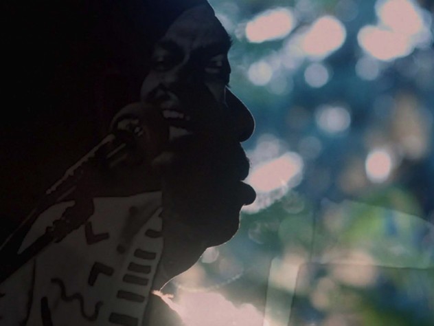 A still image from the film, This is Love, showing Rudy Love in shadowed profile
