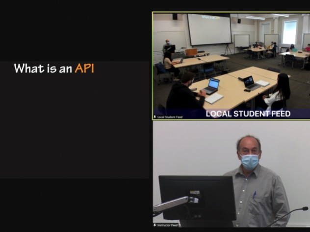 Close-up views of the “local student feed,” “instructor feed,” and a shared screen during a hybrid class.