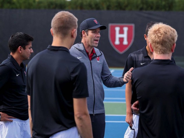 Andrew Rueb speaks to members of his team.