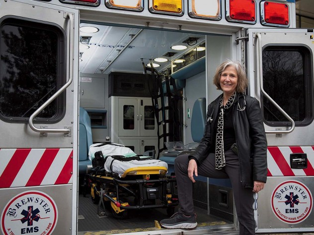 Pediatrician Eileen Costello stands next to the Boston Medical Center’s mobile pediatric clinic.