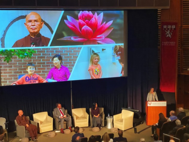 Alia Crum presents about mindfulness in allergy oral immunotherapy. Alia Crum presents about mindfulness in allergy oral immunotherapy. Thich Nhat Hanh is on the top left of the slide.