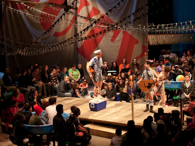 The pirates make their entrance.  Robert McLean, atop the cooler, is the Pirate King.