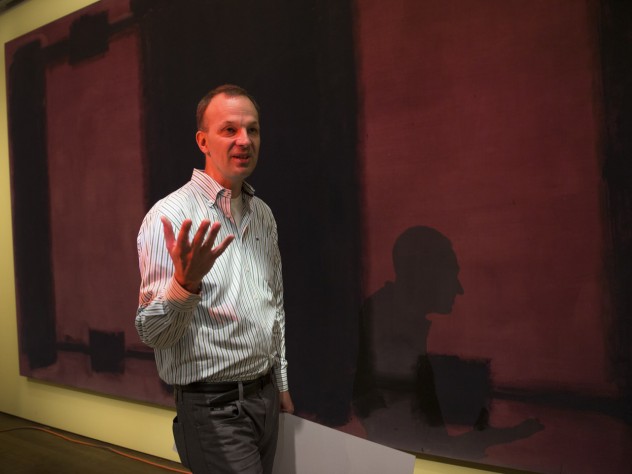 Photograph by Jim Harrison Conservation scientist Jens Stenger explains the history of Mark Rothko’s <i>Harvard Murals</i> and the details of the conservation project in front of the now-faded <i>Panel Four.</i>