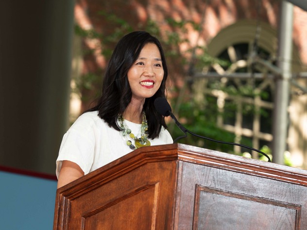 Michelle Wu behind a lectern