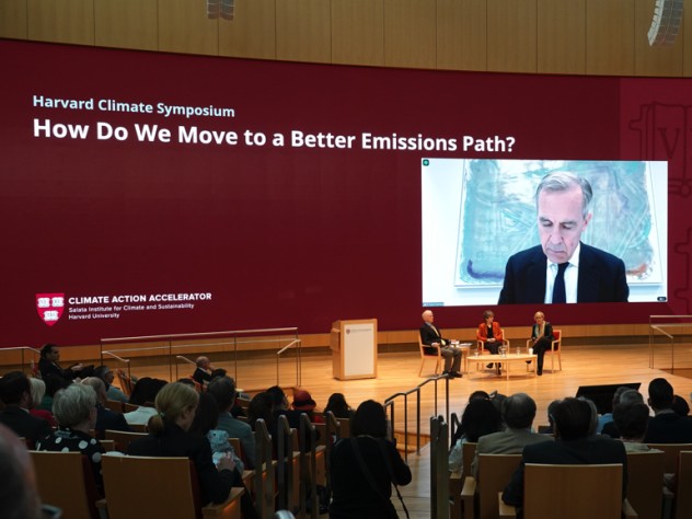 A plenary session at the Harvard Climate Symposium featured Jeremy Grantham, Janet McCabe, Gillian Tett (moderating), and via video link, Mark Carney.