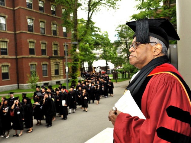 Photograph by Stu Rosner Shepherd and flock: at Memorial Church, the Reverend Peter J. Gomes awaits arrivals for the senior class chapel service.