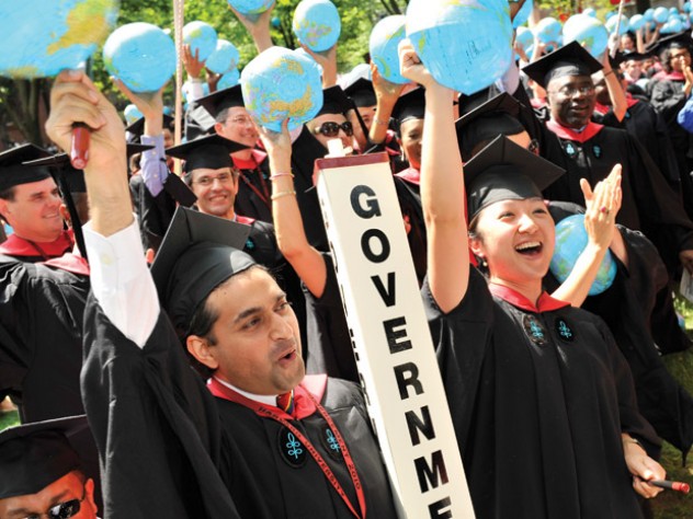 Photograph by Stu Rosner Kennedy School class marshals Asif Chishti, of Lahore, Pakistan, and Katherine Chon, of Salem, New Hampshire, both M.P.A. ’10, lead a cheer.