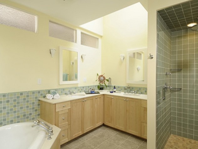 Another use of transom windows to bring light to a bathroom lacking exterior windows