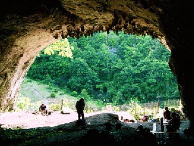 Dzudzuana Archives Views from inside and outside Dzudzuana Cave in the Republic of Georgia. Bar-Yosef and colleagues are working to date the Middle to Upper Paleolithic transition here in the Caucasus foothills, where it may have occurred much later than in other parts of Europe.