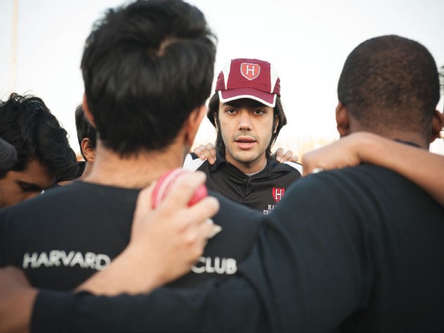 Ibrahim Khan &rsquo;14 talks strategy with teammates before a game against Boston University in May. 