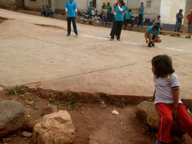 While learning about global health in the field, Amanuel and Premaratne got involved in the life of their respective communities. This picture captures Premaratne's host sister as she observes a group of local students preparing for a school race through the village. 