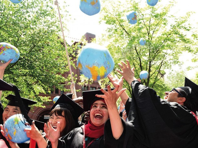 Kennedy School mid-career-degree celebrants (from left) Tadahiro Ikemoto, M.P.H. &rsquo;14, M.P.A. &rsquo;15, of Japan, Zhuldyz Bakytzhanova, M.P.A. &rsquo;15, Sahar Albazar, M.P.A. &rsquo;15, of Egypt, and Alvaro Henzler, M.P.A. &rsquo;15, of Peru