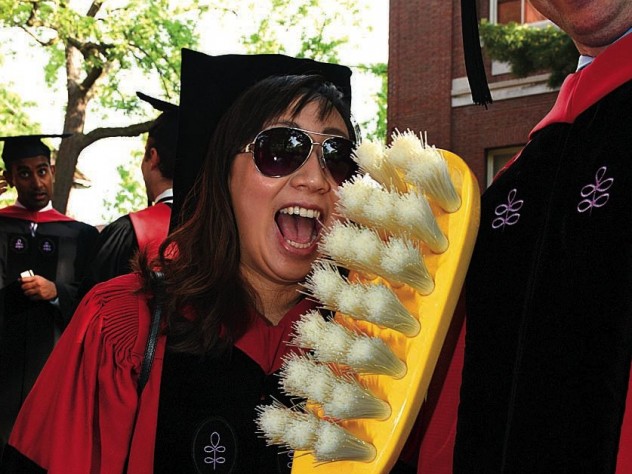 New doctor of medical sciences in oral biology (D.M.Sc.) degree-recipients Mindy Gil, D.M.D. &rsquo;11, of Palos Verdes, California, and Peter Charles Grieco, of Garfield, New Jersey, reminding revelers about good dental hygiene