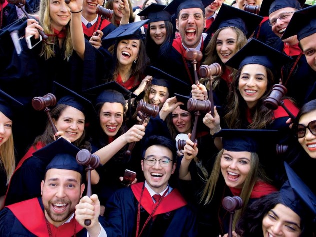 Law School graduates flaunt their profession’s symbol of authority.
