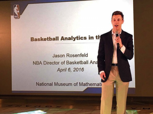 Jason Rosenfeld delivers a presentation with microphone in hand