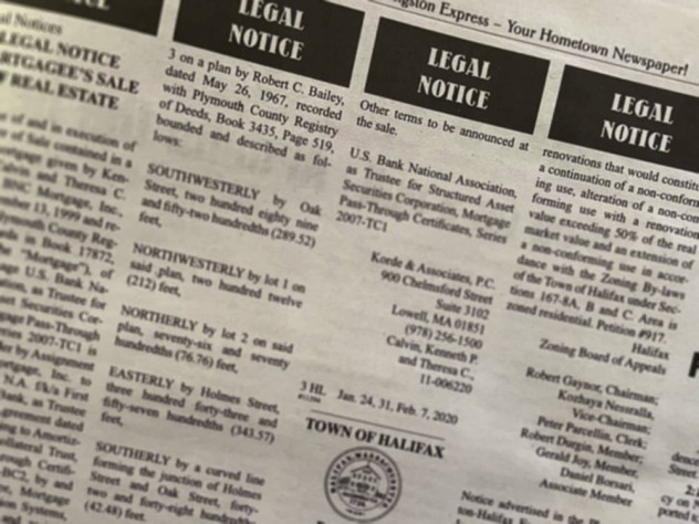A page from a newspaper showing legal notices