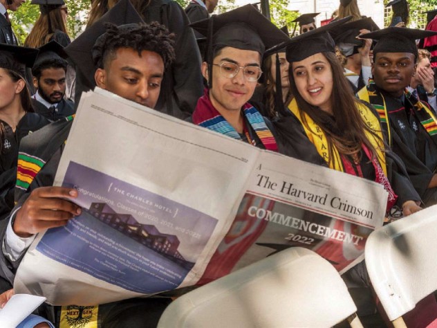 Graduates-to-be read the student newspaper, absent a University Gazette