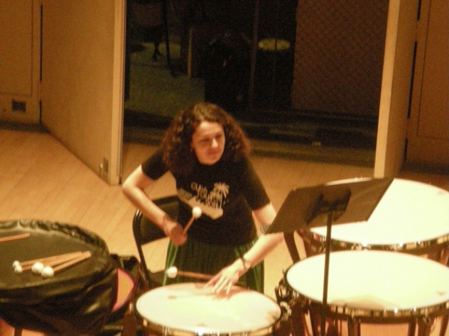 Liz Bloom ’12 focuses on her part during a pre-tour rehearsal at Harvard's Lowell Lecture Hall.