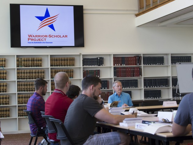 Photograph by Freddie Reed/Courtesy of the Warrior-Scholar Project Kenan professor of government Harvey Mansfield discusses Alexis de Tocqueville’s <i>Democracy in America</i> with the veterans. The WSP’s mission is to facilitate veterans’ transition into full-time students by helping them develop necessary academic skills while engaging with themes that speak to their experiences.