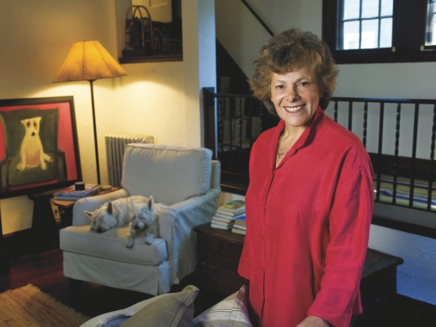 Ellen Langer at home, with her dogs and her own painting of a dog.