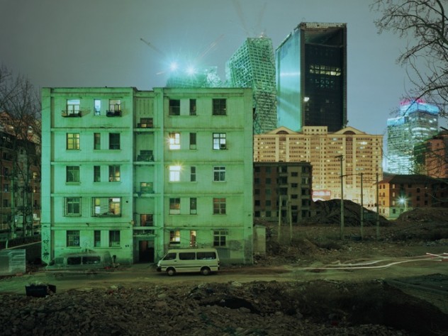 Photograph by Wang Di “Building No. 10 in Hu Jia Lou Xi Li” (2008), with the China Central Television headquarters rising to the rear.