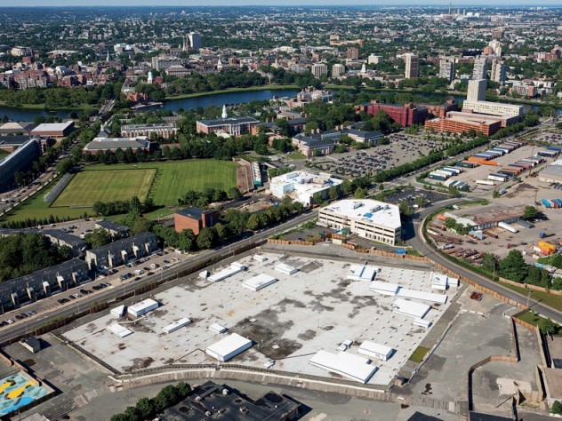 Photograph by Steve Dunwell From a vantage point south of Western Avenue in Allston, looking northeast toward Harvard Square, the unfinished science complex dominates the foreground. Beyond it lie athletic fields that may yield to expansion by the School of Public Health, the Graduate School of Education, or other academic enterprises. A business “enterprise research campus” is envisioned south of Western Avenue, across from the high-rise graduate-student housing at One Western Avenue.