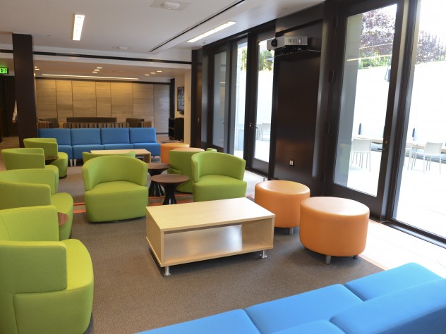 Colorful furniture in the basement-level common room next to the terrace. A student committee was consulted on furniture choices.
