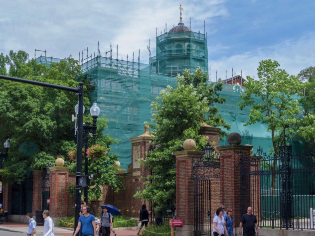Photograph, renovating Harvard Hall, shown in protective construction wrapping