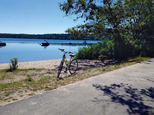Bike trail scene of Classic Cape Cod sand, water, and sky