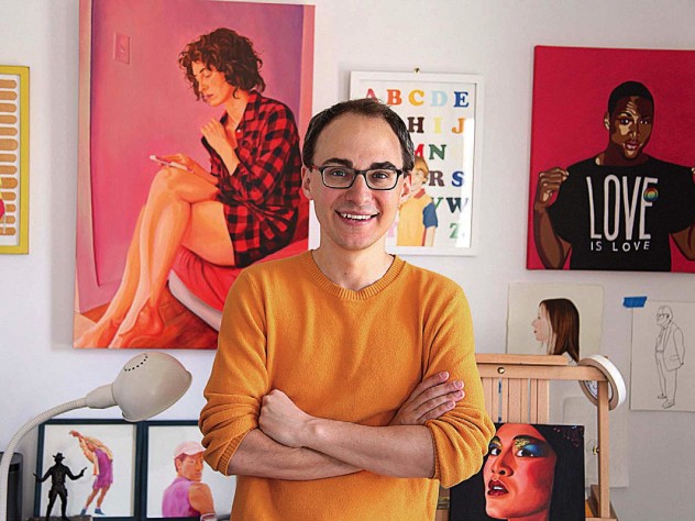 David Andersson standing among his colorful painted portraits