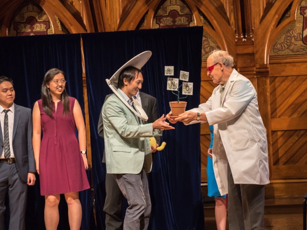 Physics winners David Hu and his team receive their prize from Dudley Herschbach.