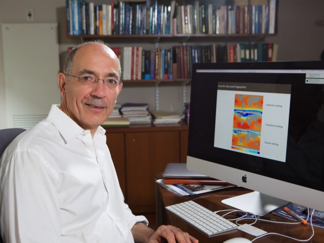 A portrait of Jerry Mitrovica at his desk