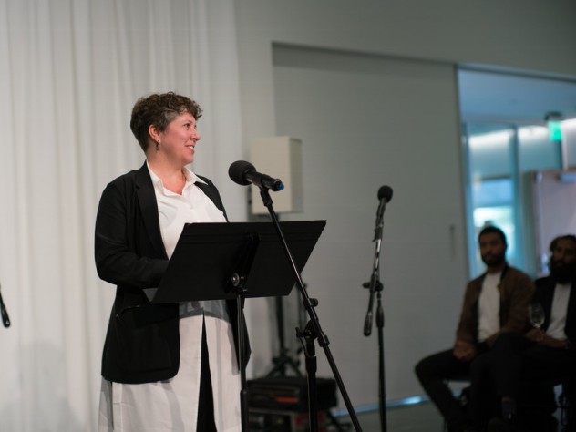 ArtLab director Bree Edwards at the microphone