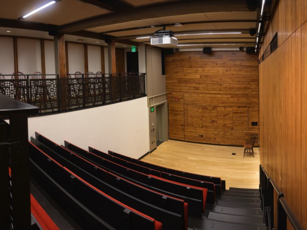 A tiered, downward-sloped theatre with 64 seats