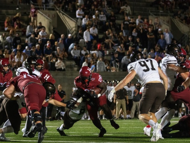 Sophomore back Sone Ntoh runs through a tackle