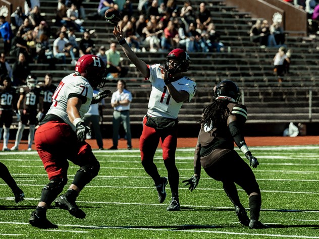Harvard quarterback Charlie Dean enjoying a day with no sacks and 20 or 29 passing