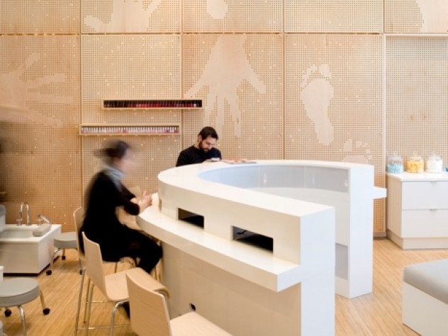 Photograph courtesy of MERGE architects Customer stations for drying finger- and toenails can convert into a wet bar when the facility converts to a for-hire party venue.
