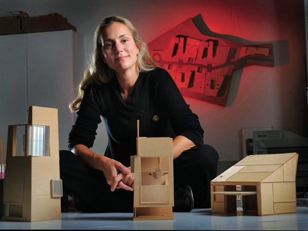 Photograph by Fred Field Elizabeth Whittaker, at her office in Boston, with basswood architectural models for residential and commercial structures