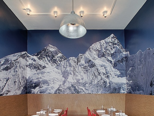 Photograph courtesy of MERGE architects A Mount Everest photo enlivens Yak & Yeti, a Nepalese/Indian restaurant in Somerville, Massachusetts.