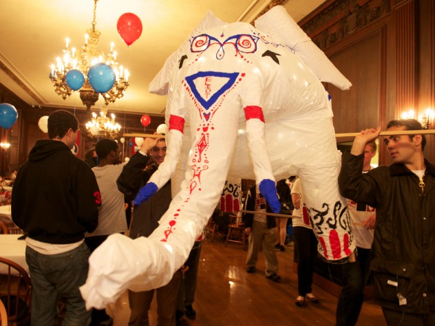 Photograph by Jim Harrison Students prepare the Eliot House elephant to appear in the 375th anniversary parade.