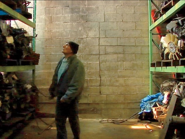 Joe, a quintessential New Yorker and central figure in <i>Foreign Parts,</i> takes a walking tour of a warehouse stocked with automobile parts.