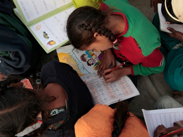 Photograph by Peter Pereira Even those who don't attend school can come to the center for basic literacy education.