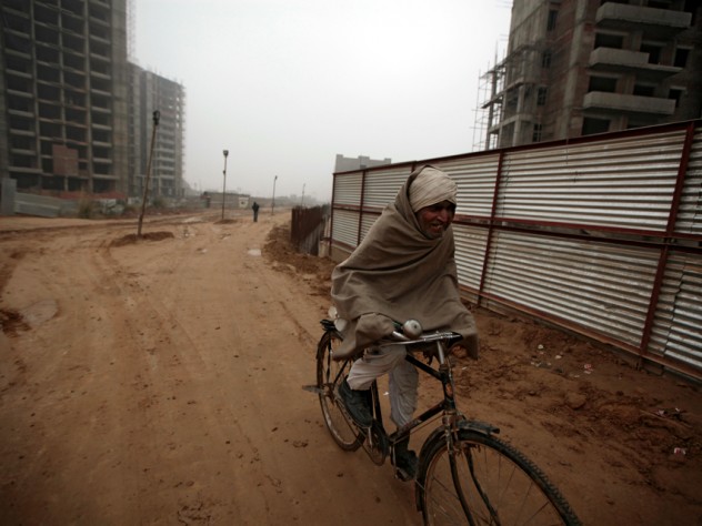 Photograph by Peter Pereira This construction site in Gurgaon, near Delhi, is part of India's building boom—and it is already home to construction workers, most of whom come from rural areas and have families in tow.