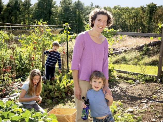 Zoe Resch with her children (clockwise from left) Prairie (9), Silas (7), and Calder (3) in their family vegetable garden in Vermont 