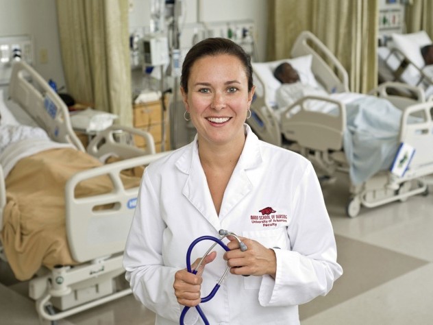 Cara Osborne, a certified midwife and professor, in a classroom (with medical training dummies) at the Eleanor Mann School of Nursing at the University of Arkansas at Fayetteville 